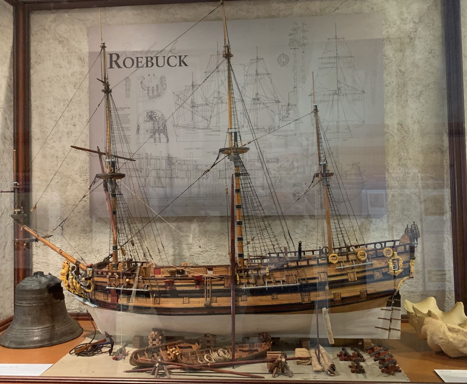 A side profile of a model of the Roebuck ship being prepared for sail.