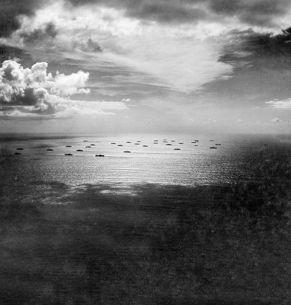 Black and white image of boats on the ocean