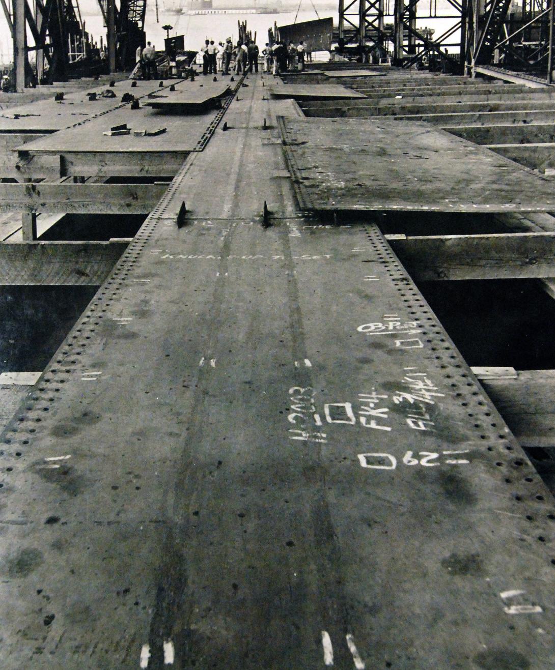 : Keel plates for a Liberty ship laid out before being welded together, 1941.  
